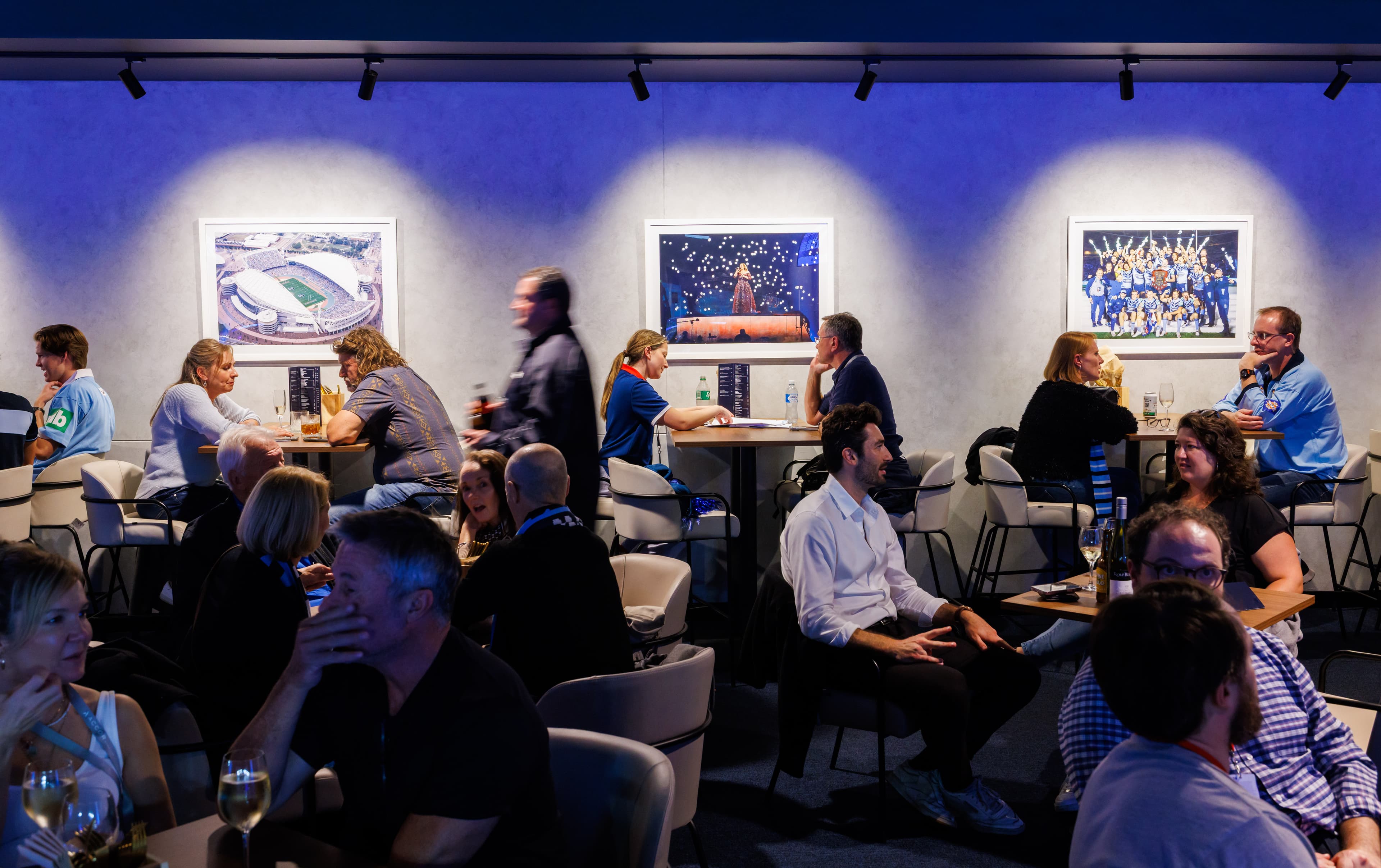 Accor Stadium members socialising in a members' lounge